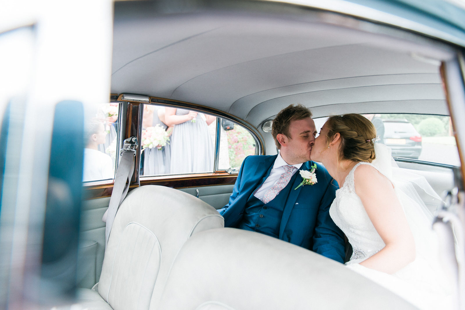 newlyweds kiss in car 