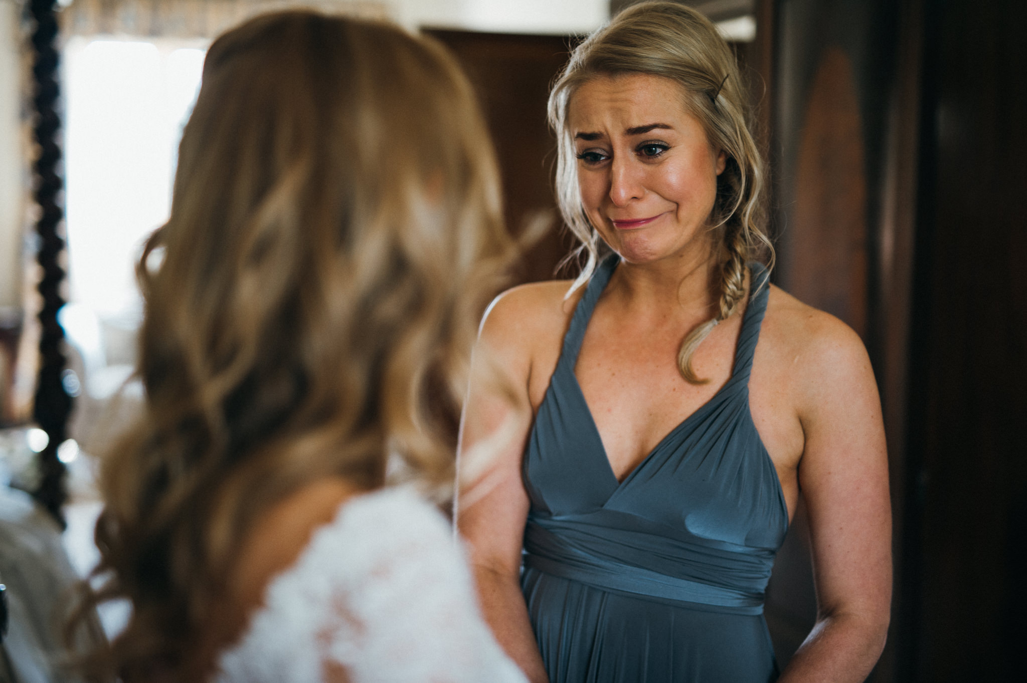 Bridesmaid showing emotion seeing Bride for first time 