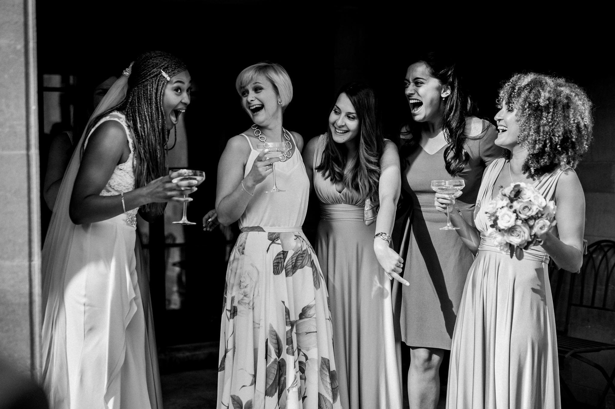 Bride laughing with friends 