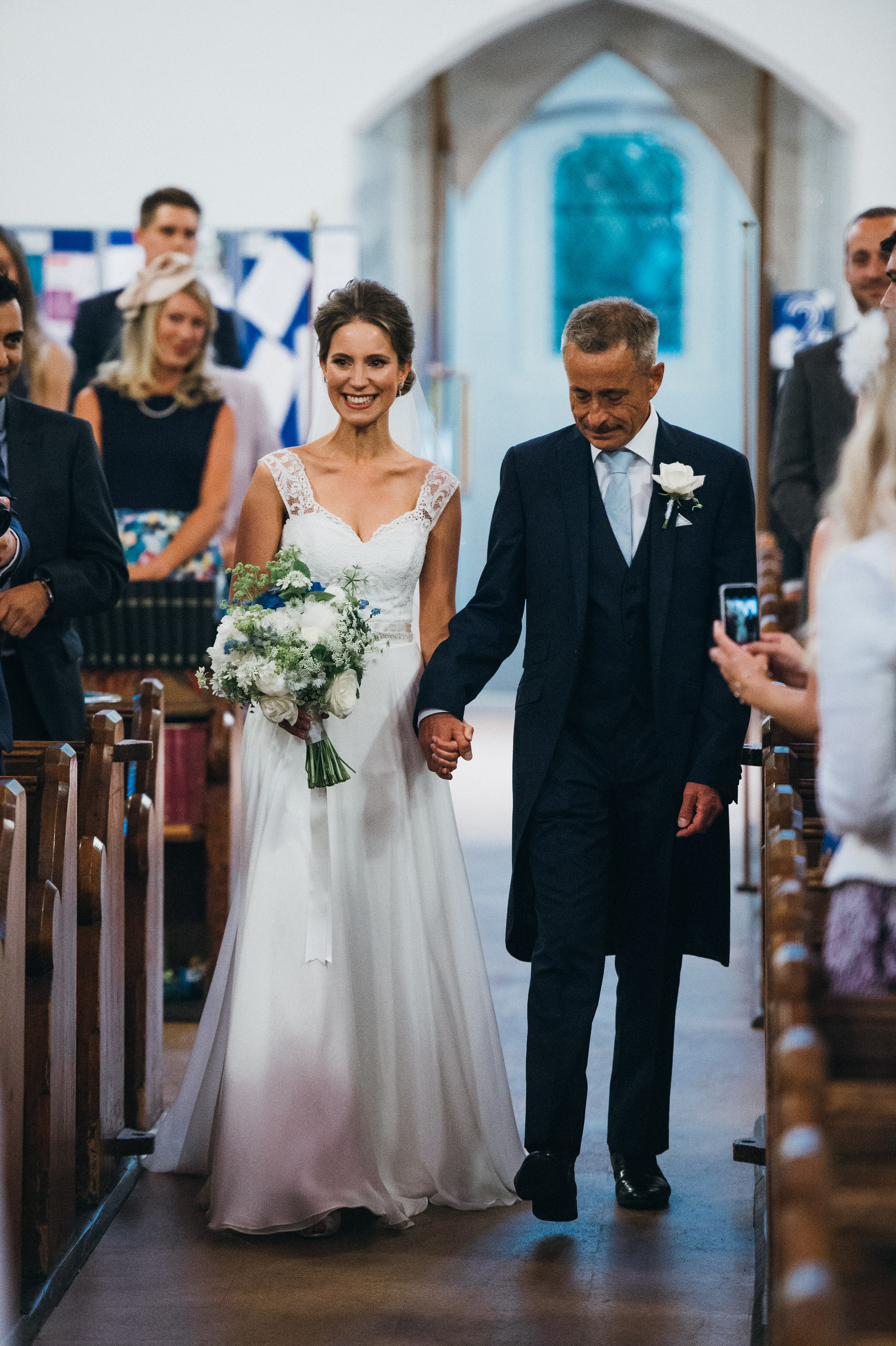 Bride walks down aisle with father 