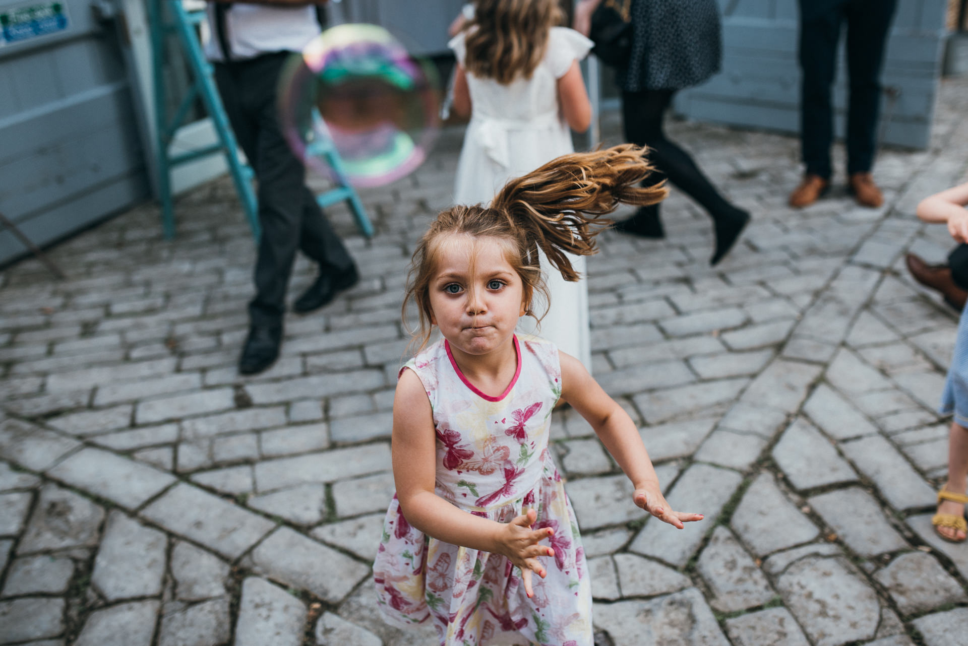 Girl chasing bubbles 