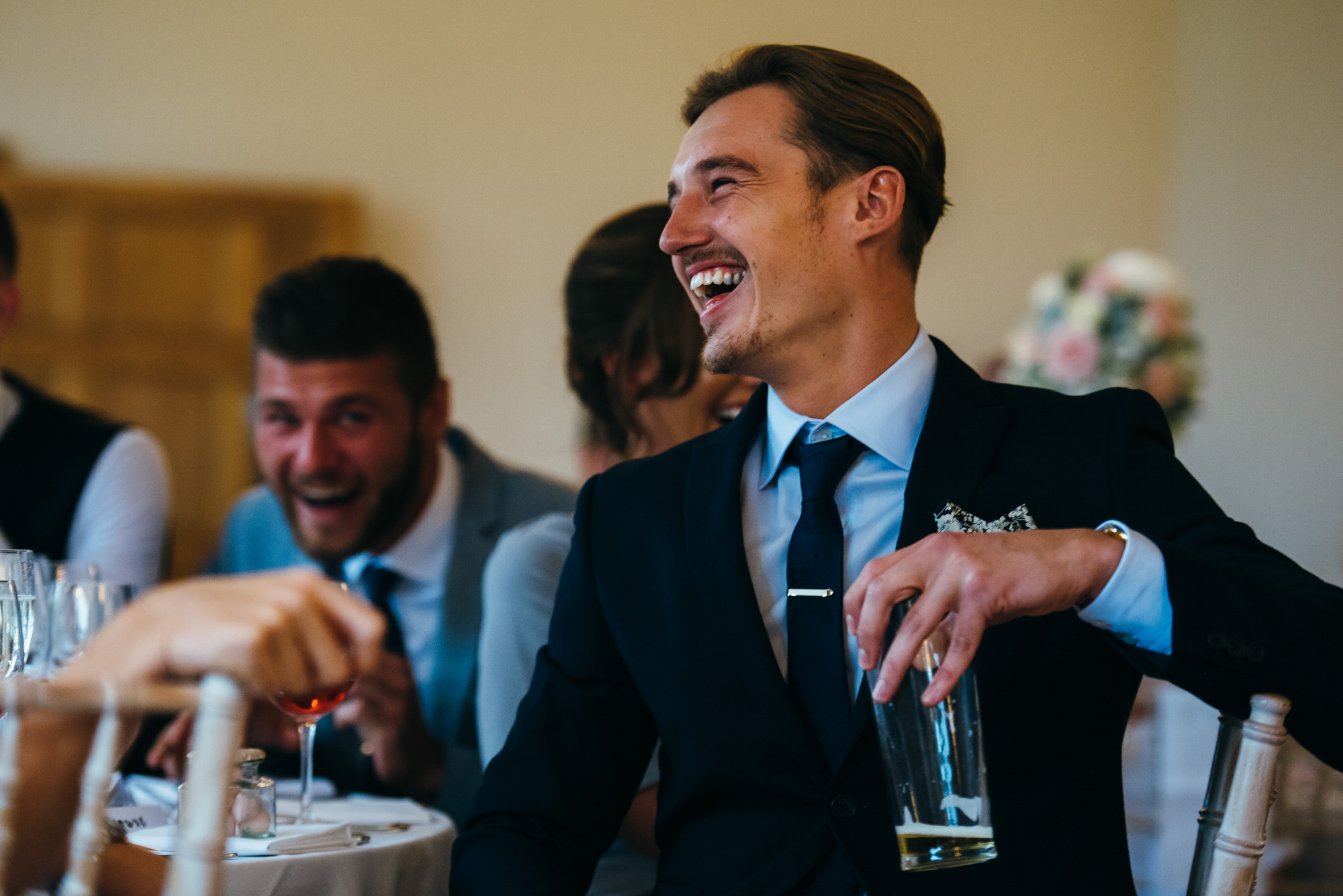 man laughing at speeches