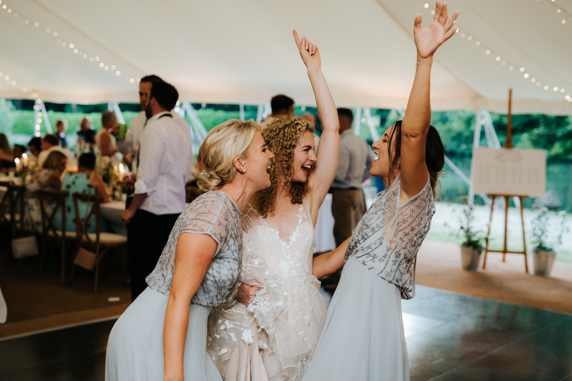 Bride and bridesmaids dancing 