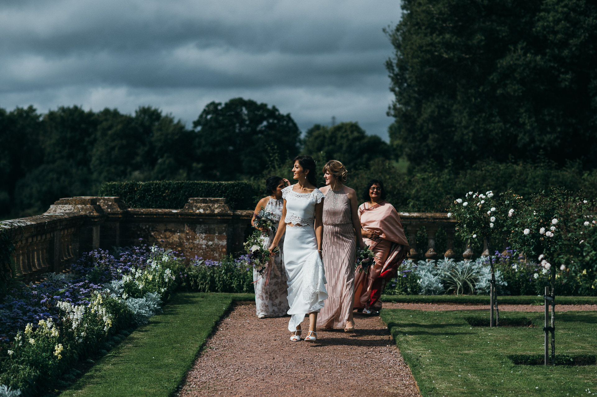 Bridal party walk to the orangery at hestercombe gardens