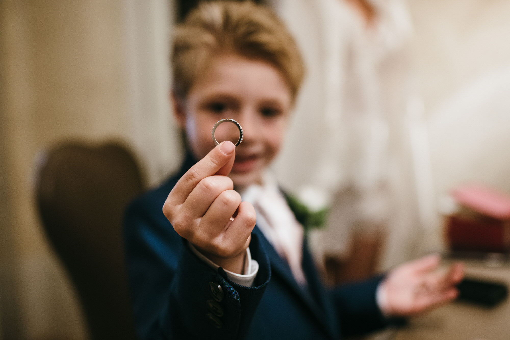 Boy holding wedding ring