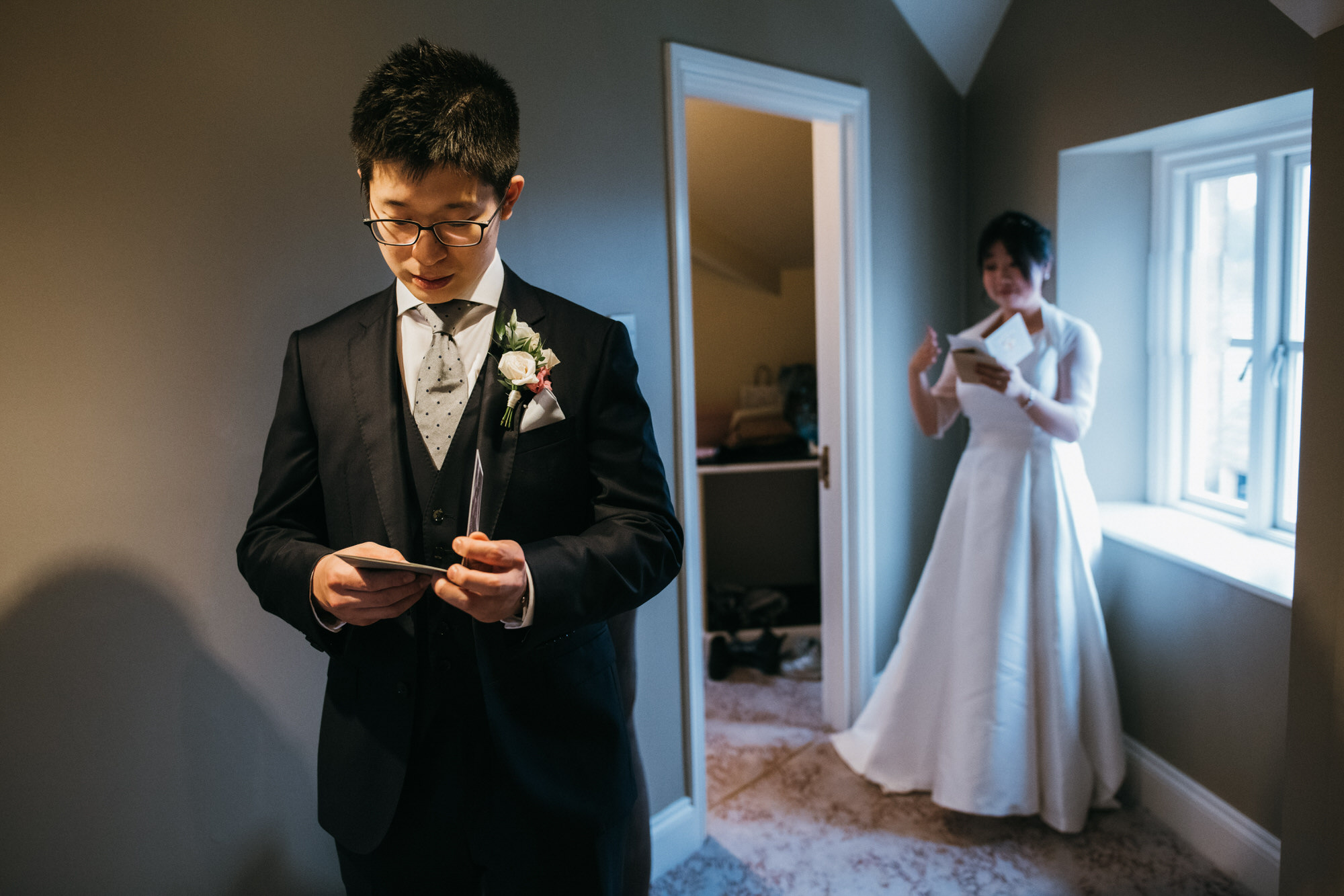 Bride and groom read letters 
