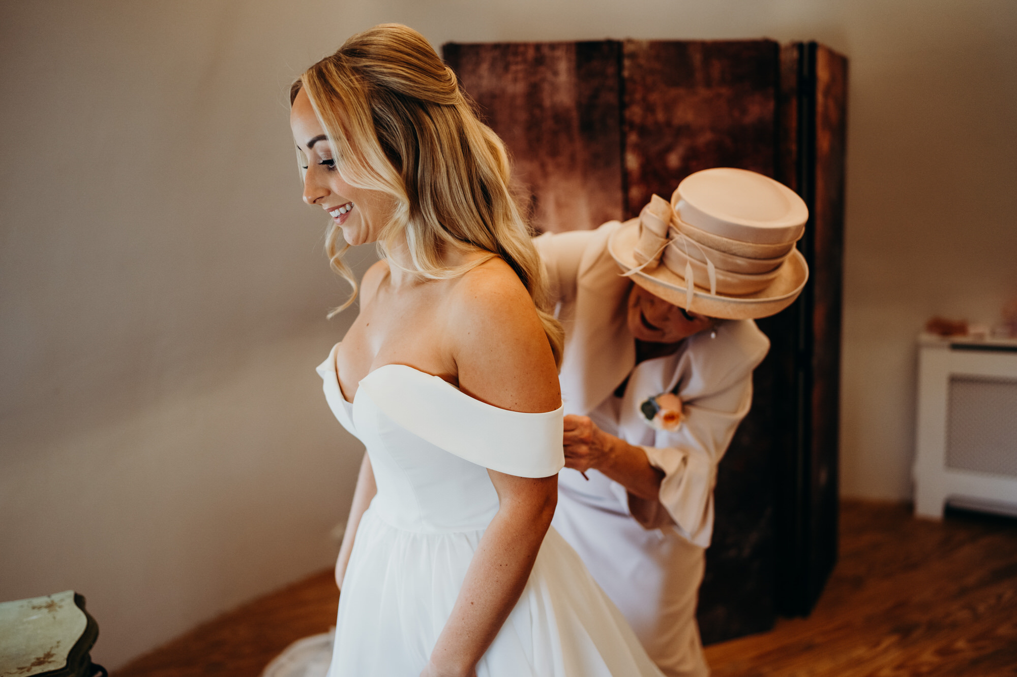 Bride dress going on at Bury Court