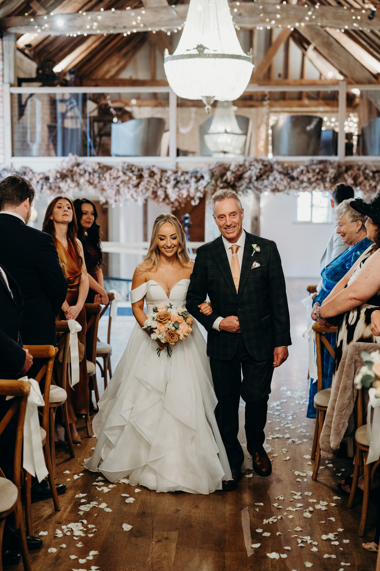 bride walks down aisle with father at Bury Court 
