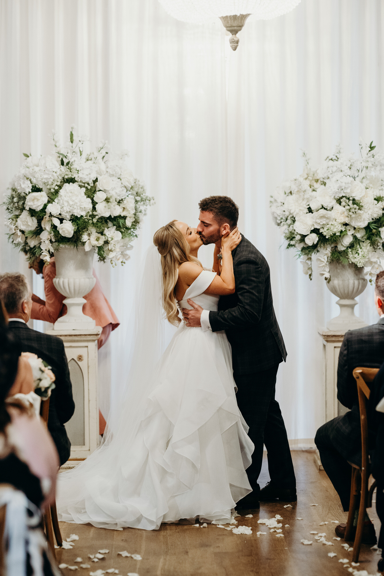Bride and Groom first kiss during wedding ceremony at Bury Court
