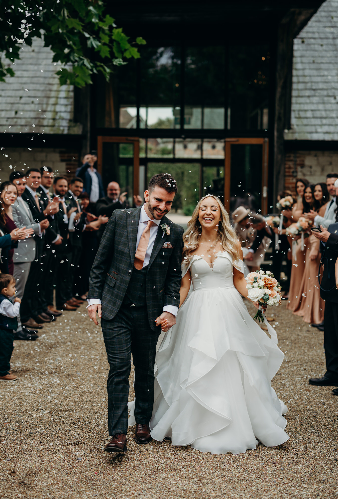 Bride and groom enjoy confetti at Bury court 