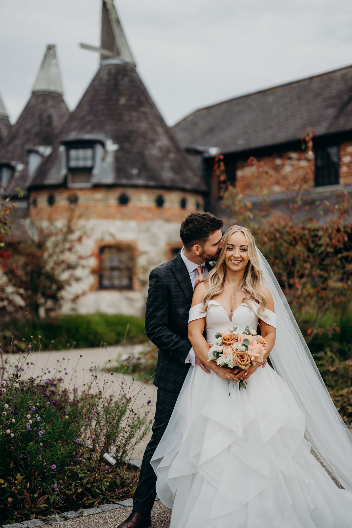 Newlyweds embrace at Bury Court 