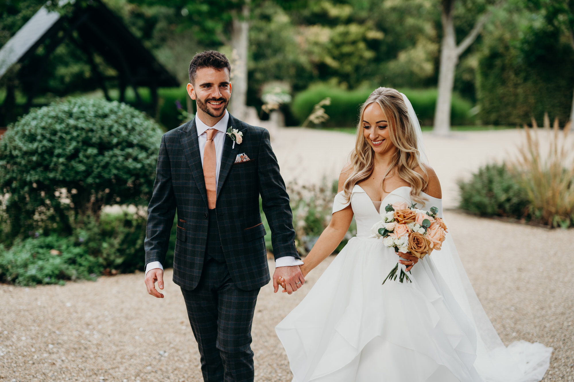Newlyweds bride and groom smiling  at Bury Court 