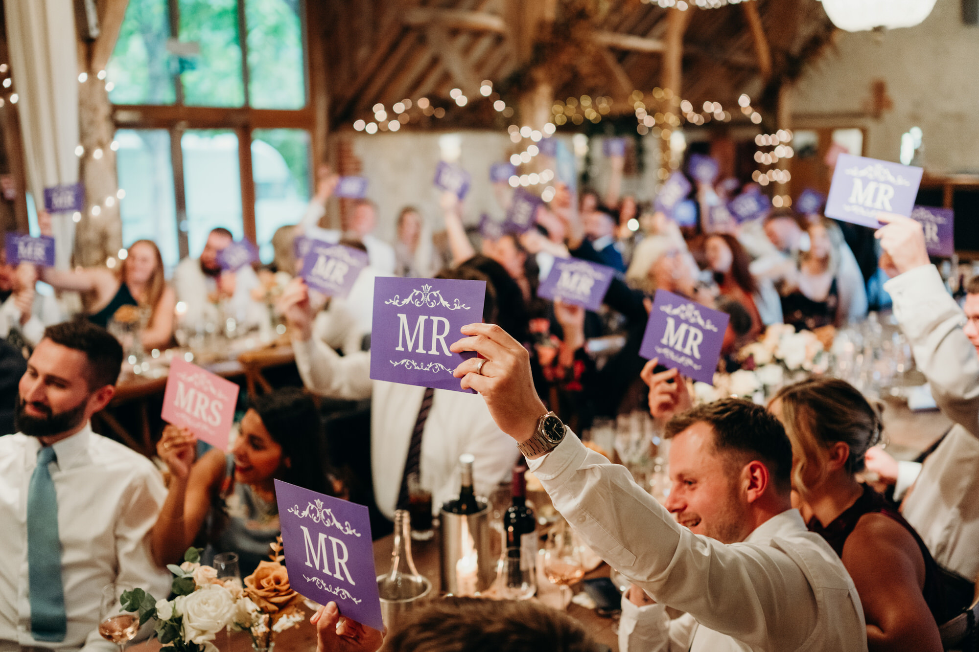 guest play mr and mrs quiz during wedding at bury court 
