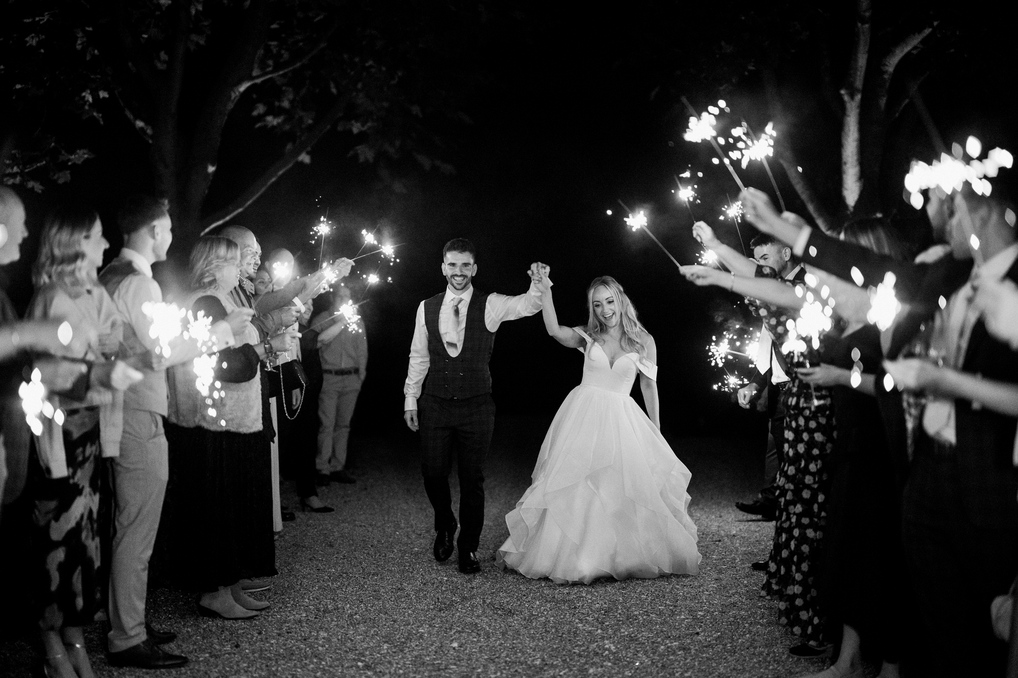 Bride and groom  during sparklers at Bury Court wedding  
